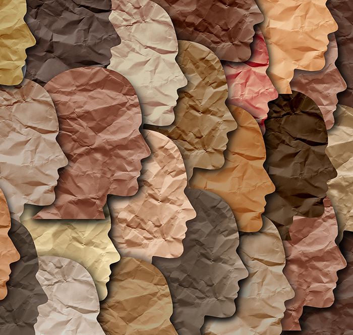image of faces cut from paper in multiple colors