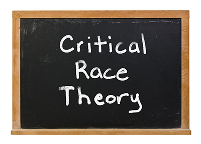 chalkboard with writing saying Critical Race Theory