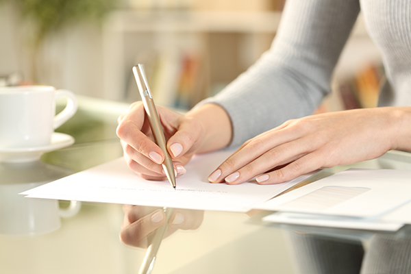 image of woman writing a letter