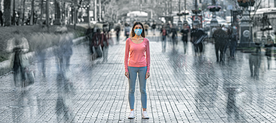 woman in crowd with mask on